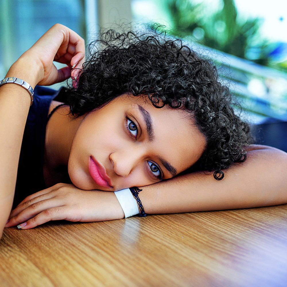 Girl Resting on Desk