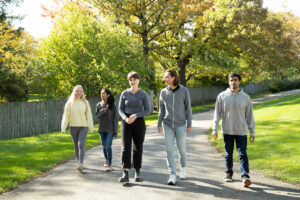 Residents walking together on the SunCloud Health grounds