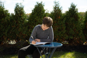 Resident journaling outdoors